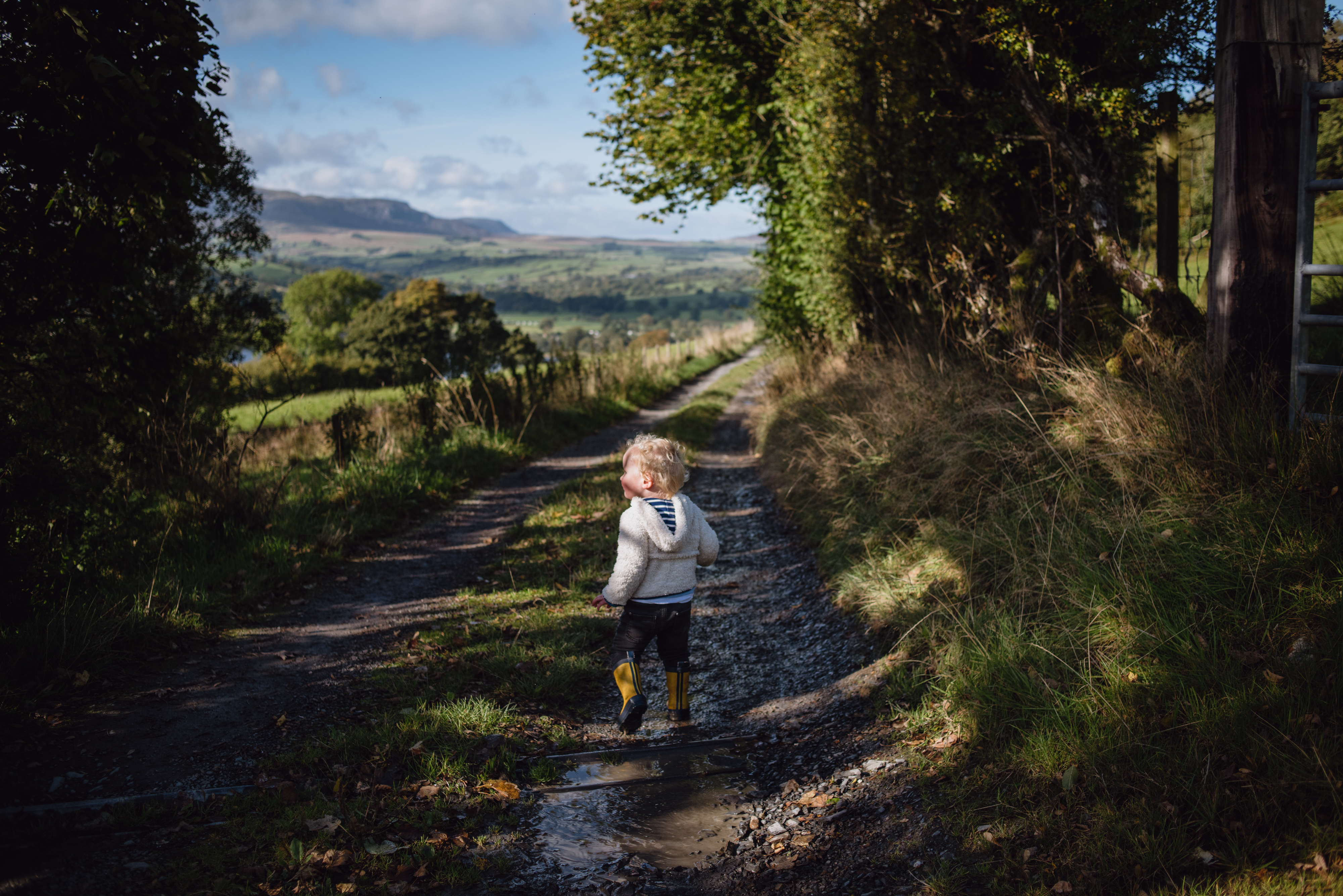 Boy splashing down lane